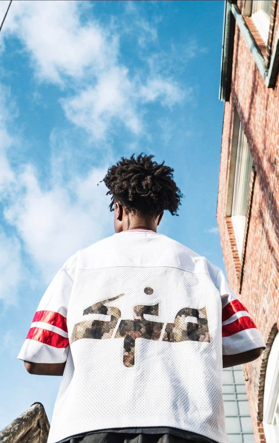 Shafra white jersey back graphic campaign